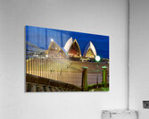 Sydney Opera House illuminated at dusk with crowds on steps. Acrylic Print