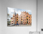Historic brick building with a tower and people walking. Acrylic Print