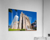 Historic church stands tall next to modern skyscrapers. Acrylic Print