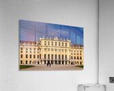 Ornate yellow palace facade with people and blue sky. Acrylic Print