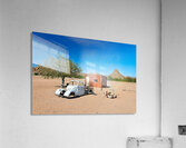 Classic car wreck in Namibias desert landscape near a structure Acrylic Print