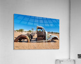 Classic car wreck rests in the Namib desert under a clear sky Acrylic Print