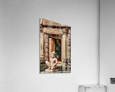 Ancient Cambodian temple with intricate carvings and stone statu Acrylic Print