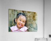 Joyful young girl with a playful smile and tongue out. Acrylic Print