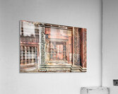 Ancient temple wall with intricate reddish stone carvings and co Acrylic Print