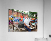 Boy with food tray clothes drying in background. Acrylic Print