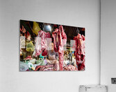 Woman selling raw meat in a bustling market. Acrylic Print