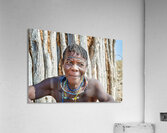 Old woman of Zemba Bantu ethnic group sits near wooden wall in N Acrylic Print