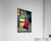 Smiling young monk in red robes at colorful traditional building Acrylic Print