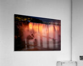 Niagara Falls illuminated orange at night. Acrylic Print