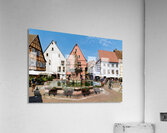 Visitors enjoy Saint Leon square in Eguisheim Alsace on a sunny Acrylic Print