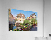 Visitors stroll by timber framed houses along the canal in Colma Acrylic Print