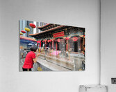 Woman prays with incense at colorful Chinese temple in Hong Kong Acrylic Print