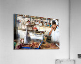 Man talks on phone at busy fish market in Dubai UAE Acrylic Print