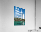 Burj Al Arab hotel stands tall by the water with palm trees Acrylic Print