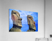 Two Moai statues against a blue sky. Acrylic Print