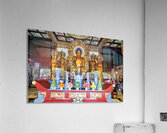Visitors observe golden statues in Shanghai Buddhist temple inte Acrylic Print