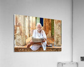 Man reads newspaper on street in Jaisalmer Rajasthan India Acrylic Print