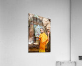 Hindu monk stands near statue in Jaisalmer Jain temple Acrylic Print