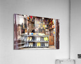 Moroccan babouches shoes in a Fez shop with a vendor Acrylic Print