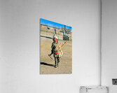 Indigenous boy with tools walks through a dusty village. Acrylic Print