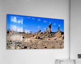 Arid desert with unusual rock pillars against a blue sky. Acrylic Print