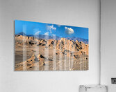 Rugged desert mountains under a clear blue sky with clouds. Acrylic Print