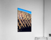 Hiker traverses a dramatic shadowed desert landscape. Acrylic Print