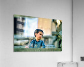 Sad boy sitting on stairs in Lahore Pakistan during the day Acrylic Print