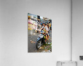 Motorbike family ride through busy Ho Chi Minh street in Vietnam Acrylic Print