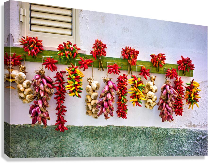 Vieste Gargano. Apulia Puglia Italy. Red chilishallot and garlic hanged to dry outside a house