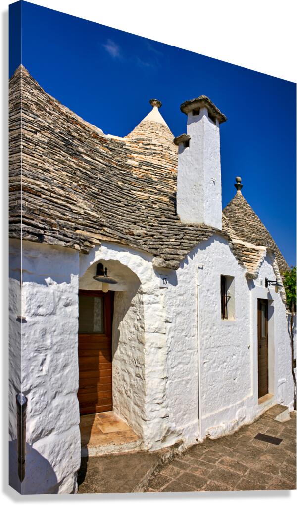 Apulia Puglia Italy. Alberobello. Trulli: traditional Apulian dry stone huts with a conical roof.