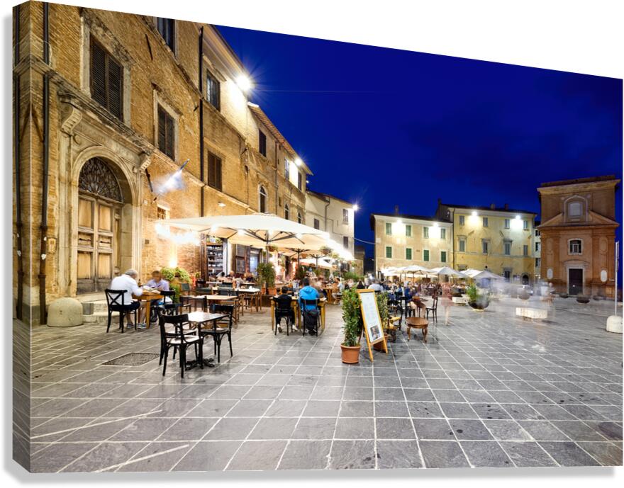 Montefalco Umbria Italy. Piazza del Comune at sunset. People eating out