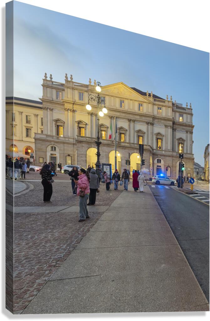 Milan. Italy. La Scala opera house in Milan at dusk with people 