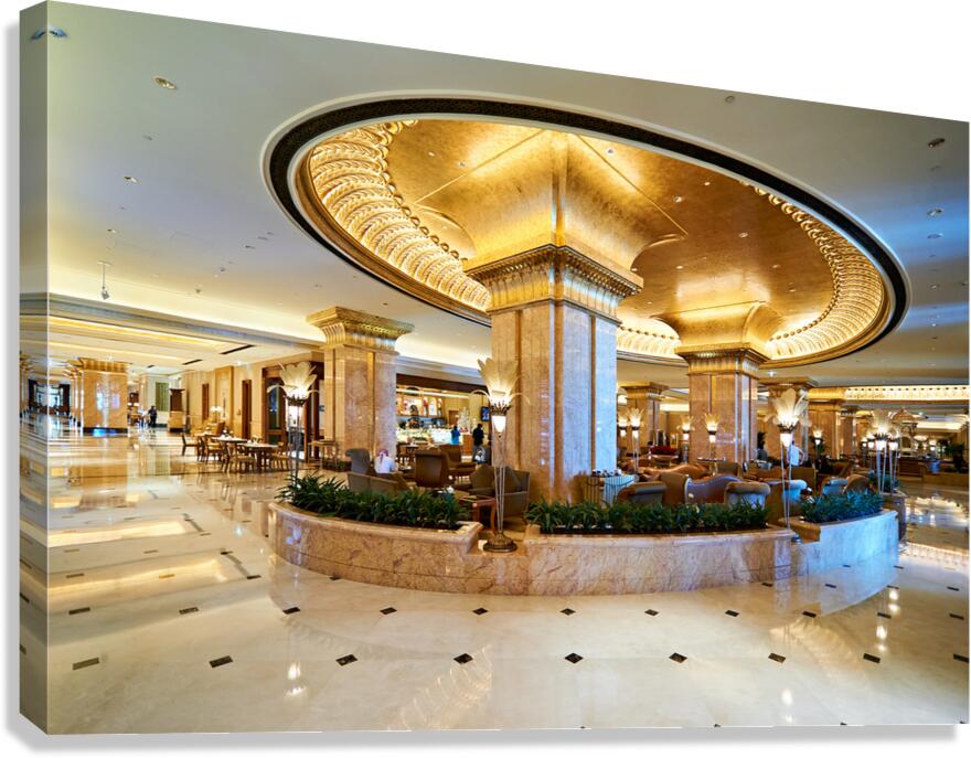 Luxurious hotel lobby with ornate gold and marble decor.