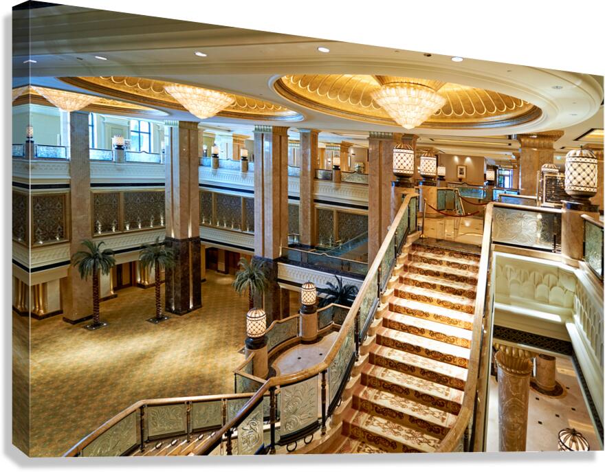 Grand staircase in a luxurious opulent hotel lobby.