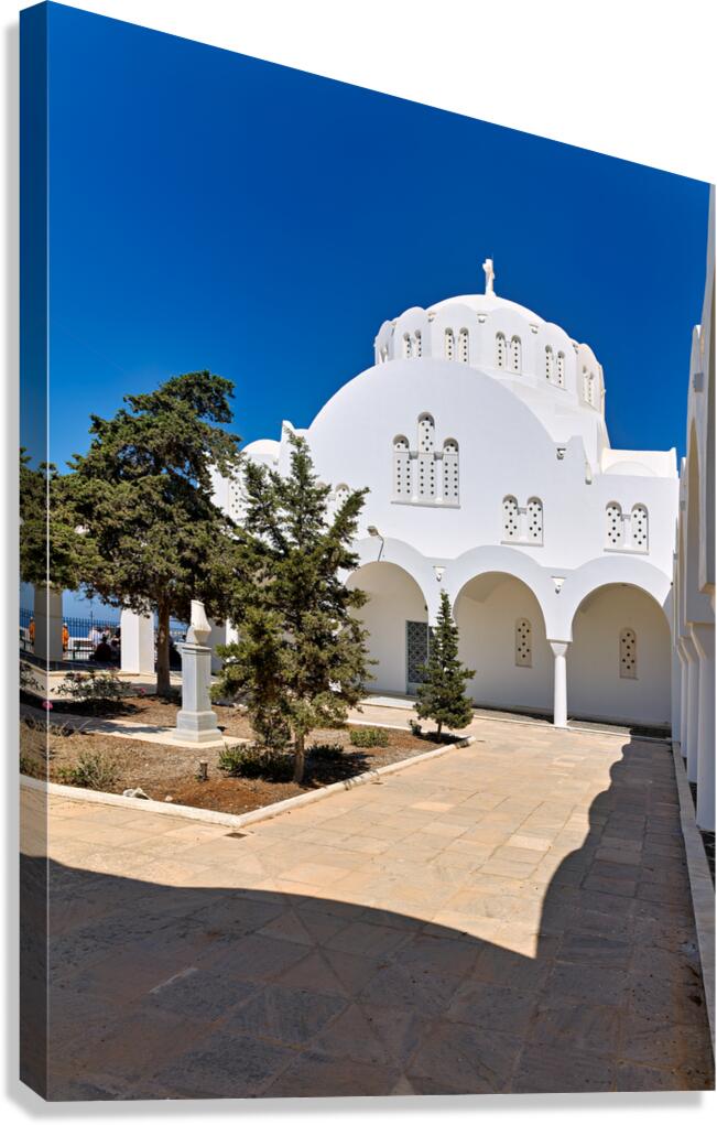 Beautiful white church green trees and blue sky.