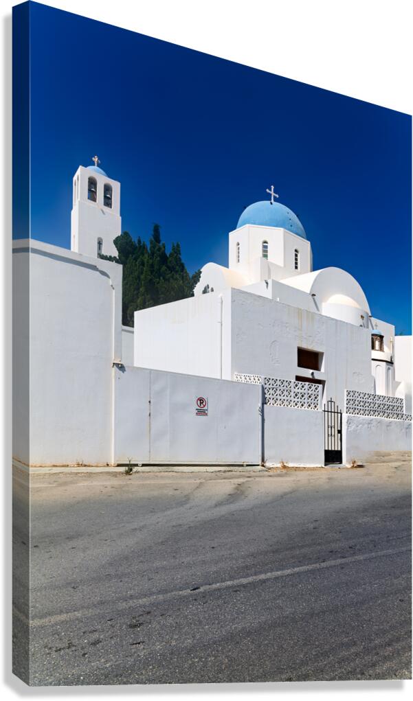 White church blue dome bell tower clear sky.