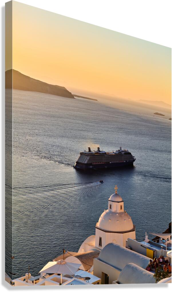 Cruise ship sails past Santorini dome at sunset.