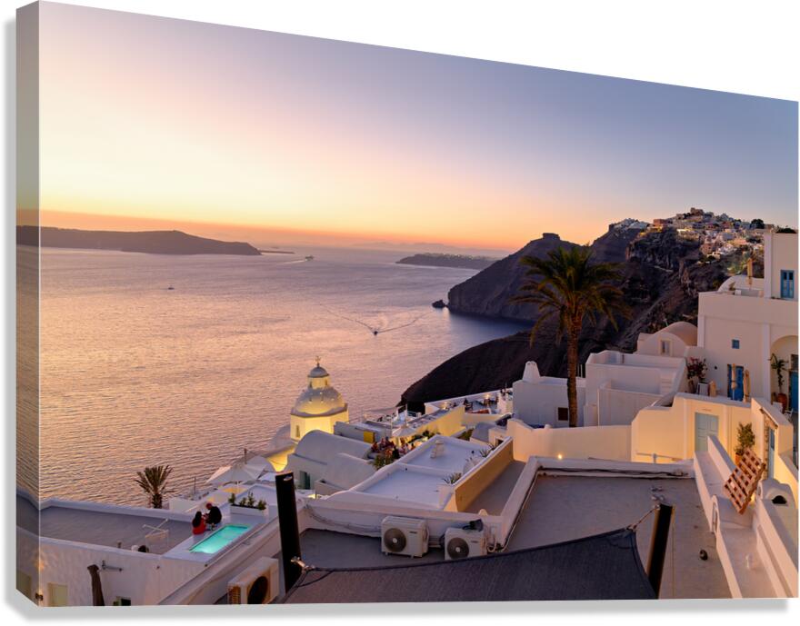 Scenic Santorini sunset white buildings overlooking the caldera