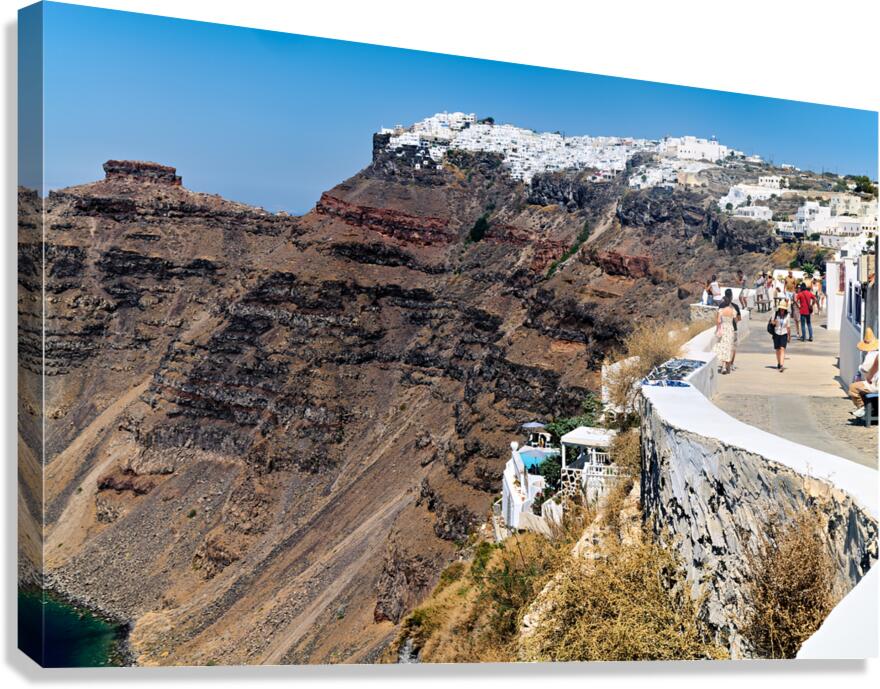 Scenic Santorini: white village caldera and tourists.