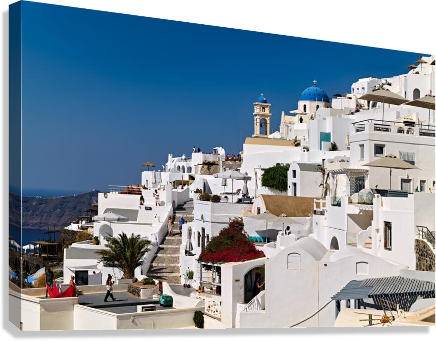 Santorinis iconic white buildings blue domes and caldera view