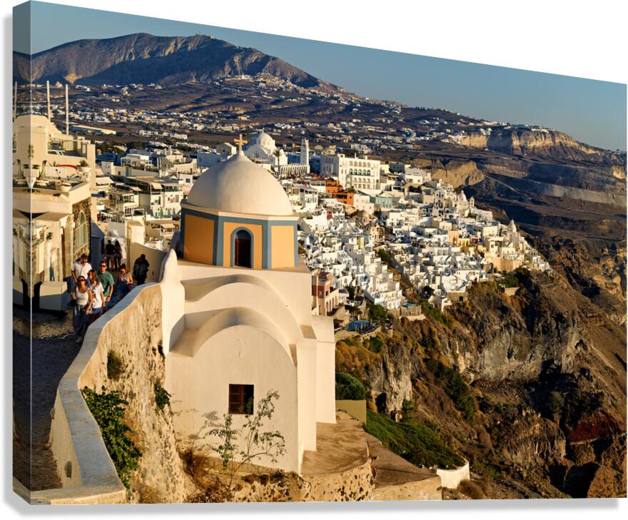 Scenic Santorini cliffside town with church and distant mountain