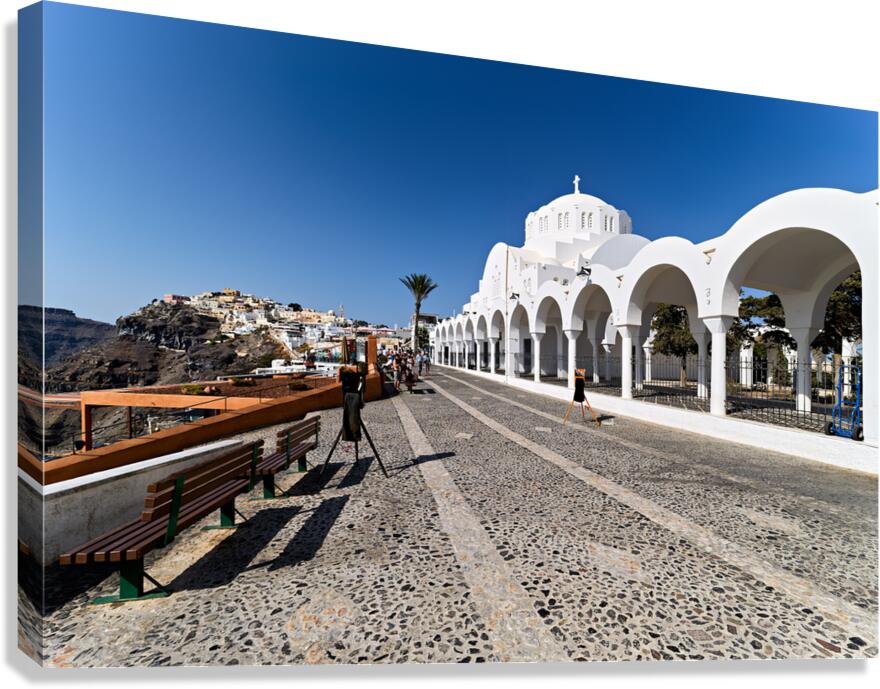 Santorinis iconic white church cobblestone path and cliffside