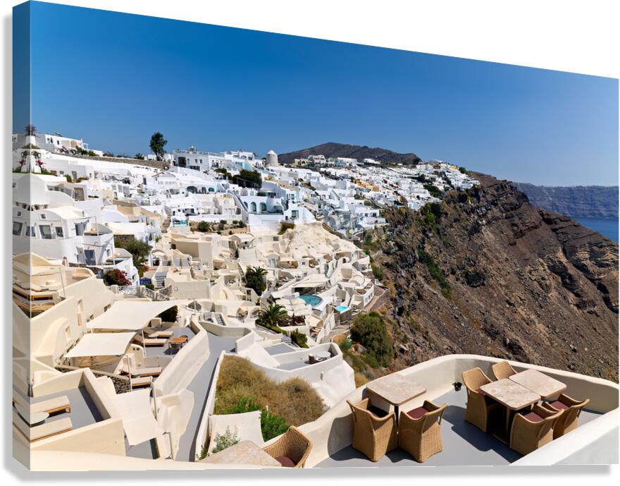 Santorinis iconic white village on a cliff overlooking the cald