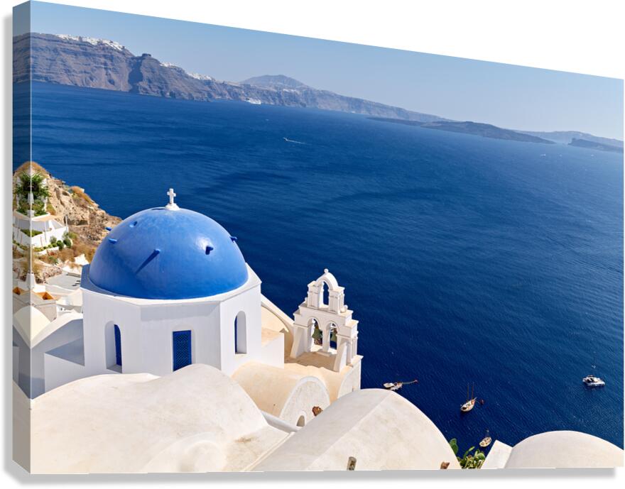Santorini blue domed church overlooking the Aegean Sea and calde