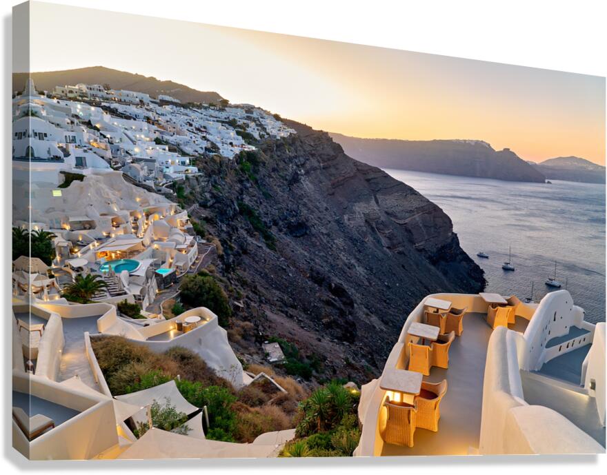 Sunset over Santorinis white village and caldera.