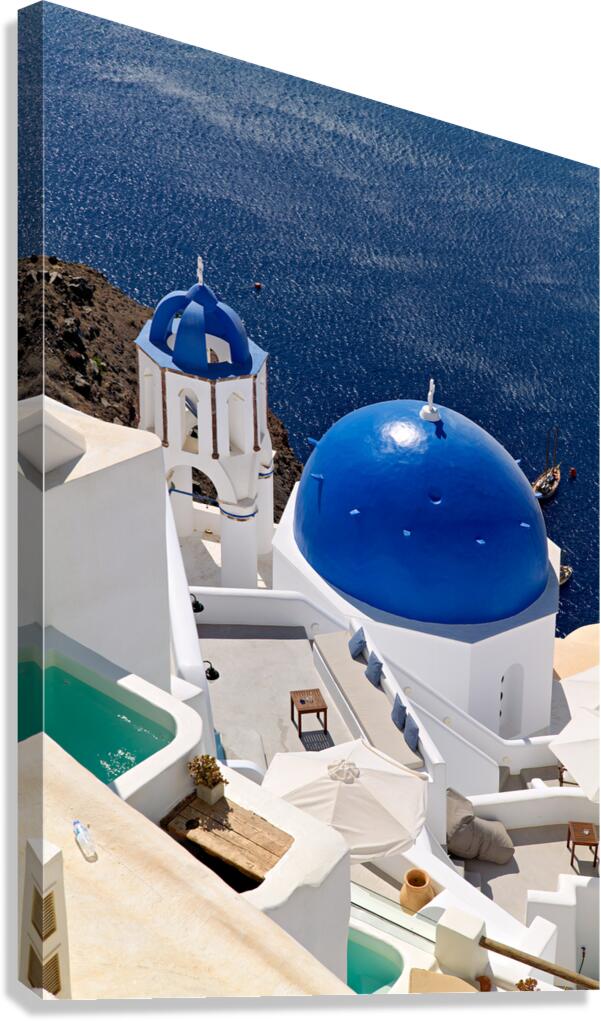 Santorinis iconic blue domes and white architecture overlooking