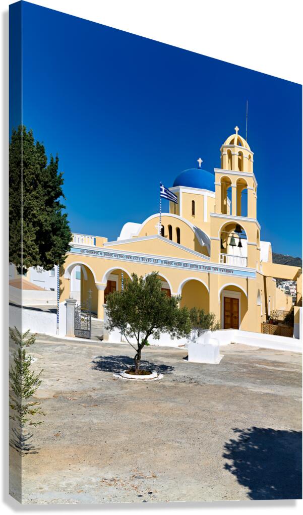 Beautiful Greek church with blue dome and bell tower.