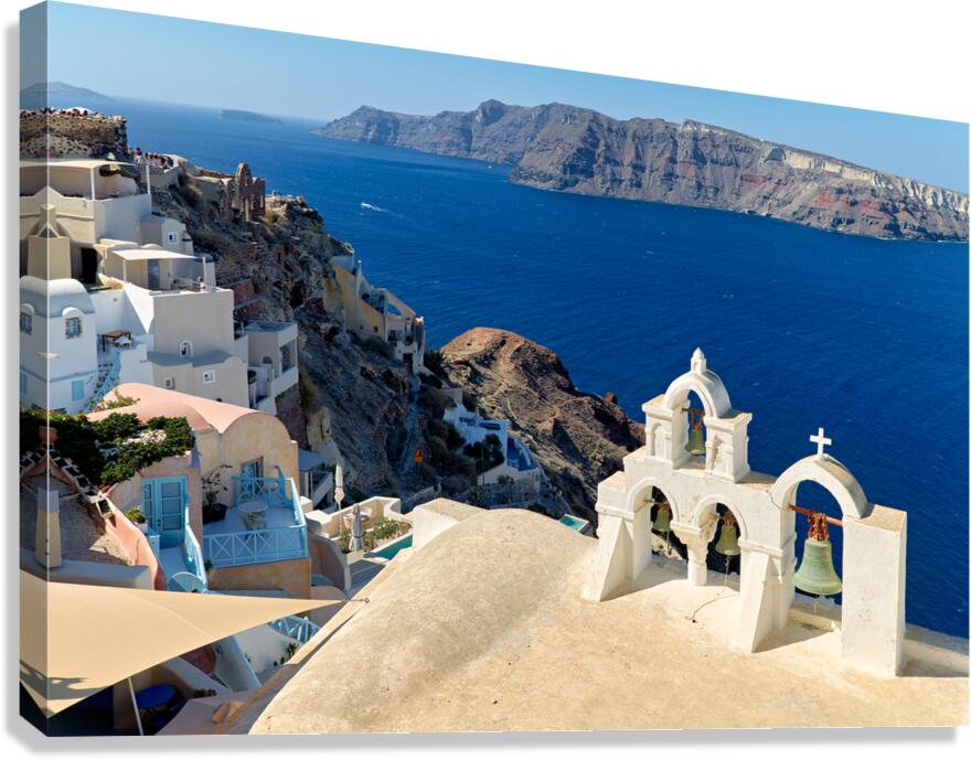 Picturesque Santorini village church bells and deep blue sea.
